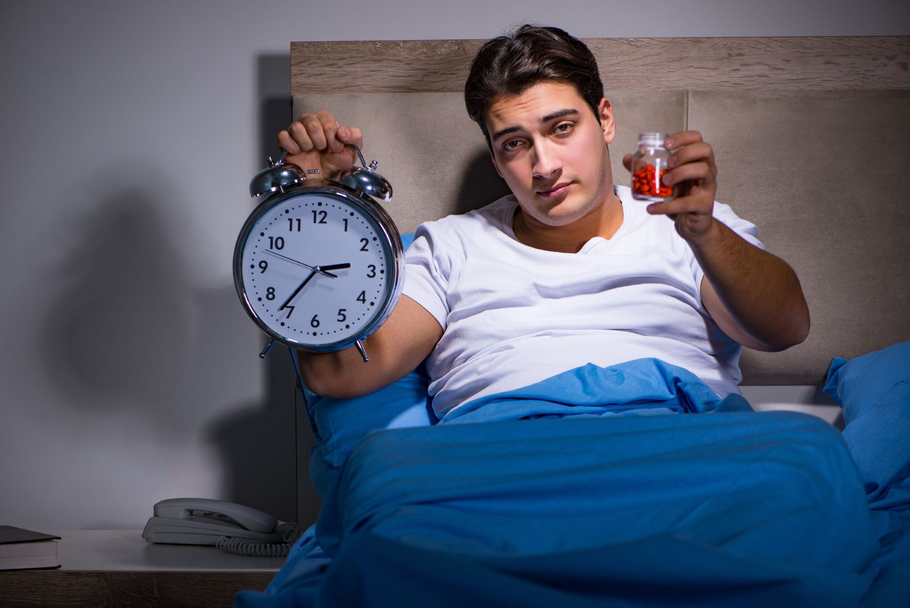 Man choosing between waiting for a cure or treating hair loss