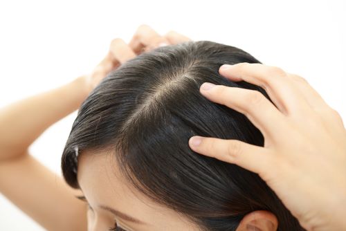 Scalp massage with essential oils