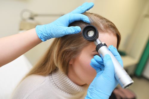 Woman getting trichologist consult