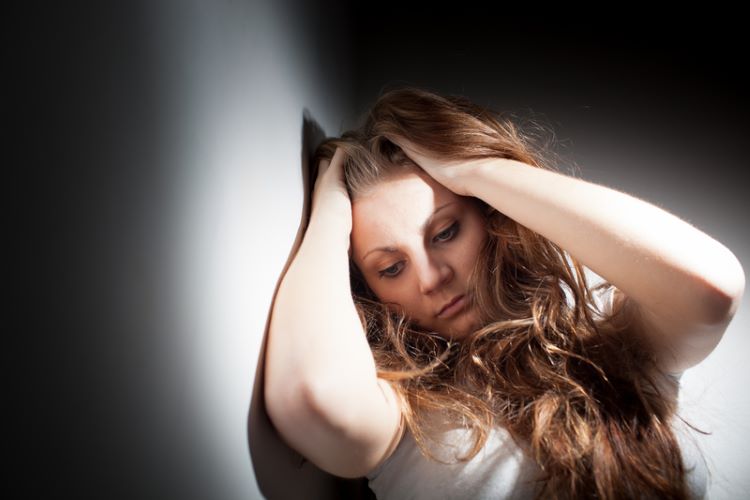 Woman with stress-induced scalp tenderness