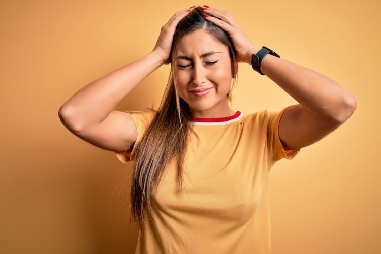 Woman with tender scalp from mechanical tension