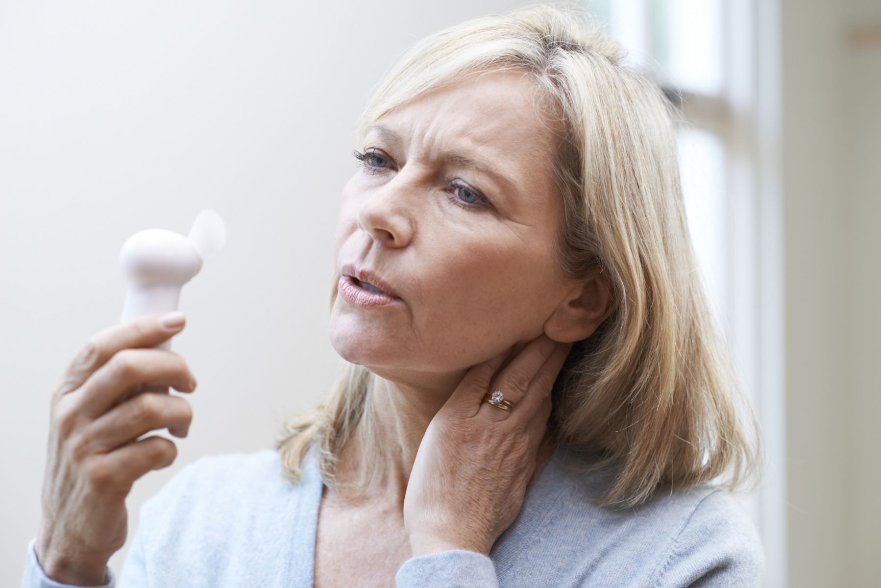 woman experiencing a menopausal hot flash