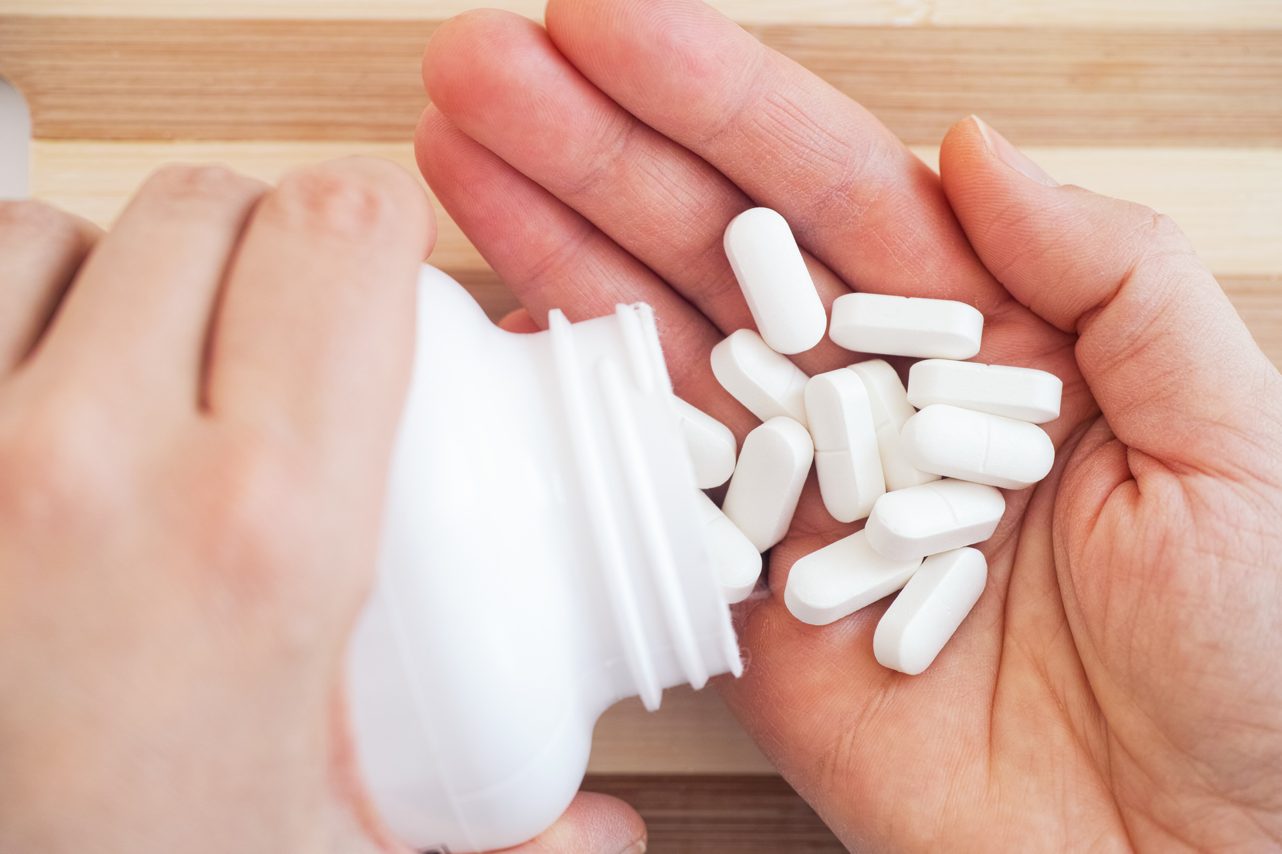 magnesium pills coming out of a bottle