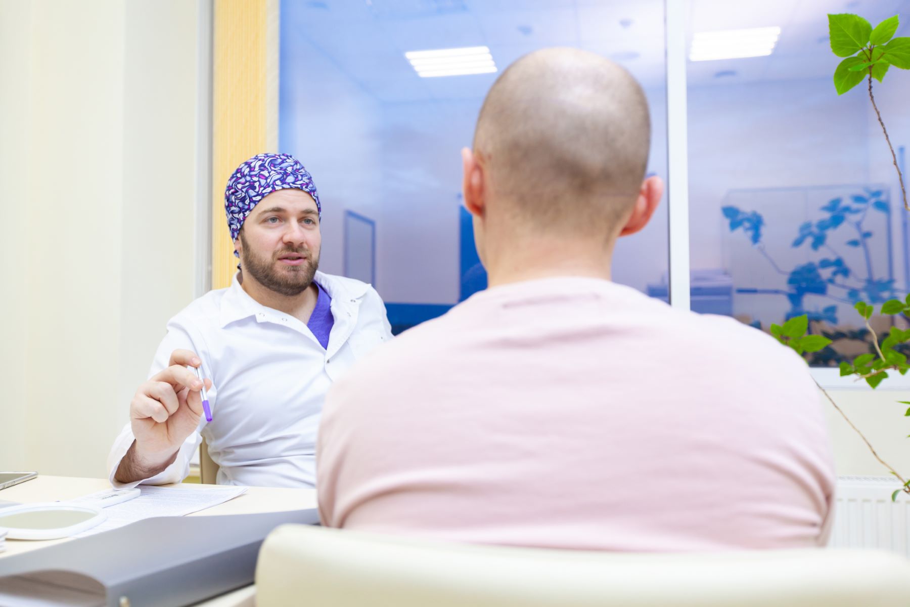 Hair doctor advising patient