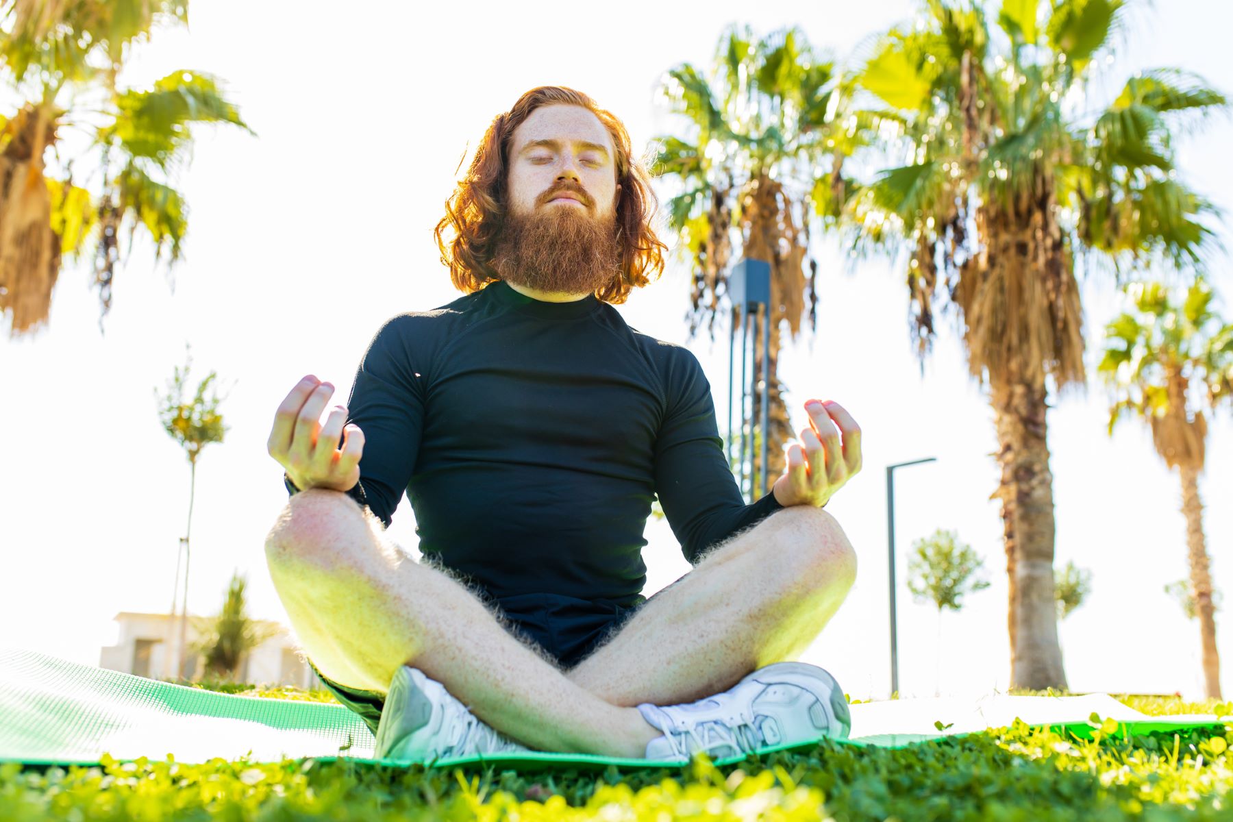 Man meditating outdoors