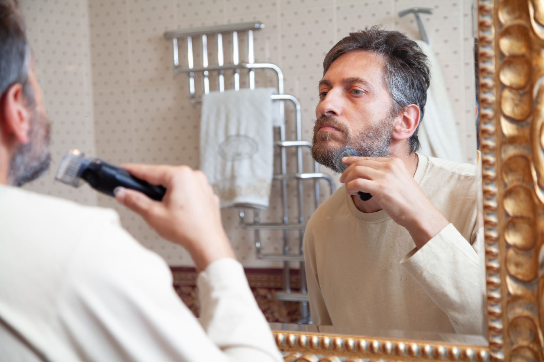 Man trimming his beard