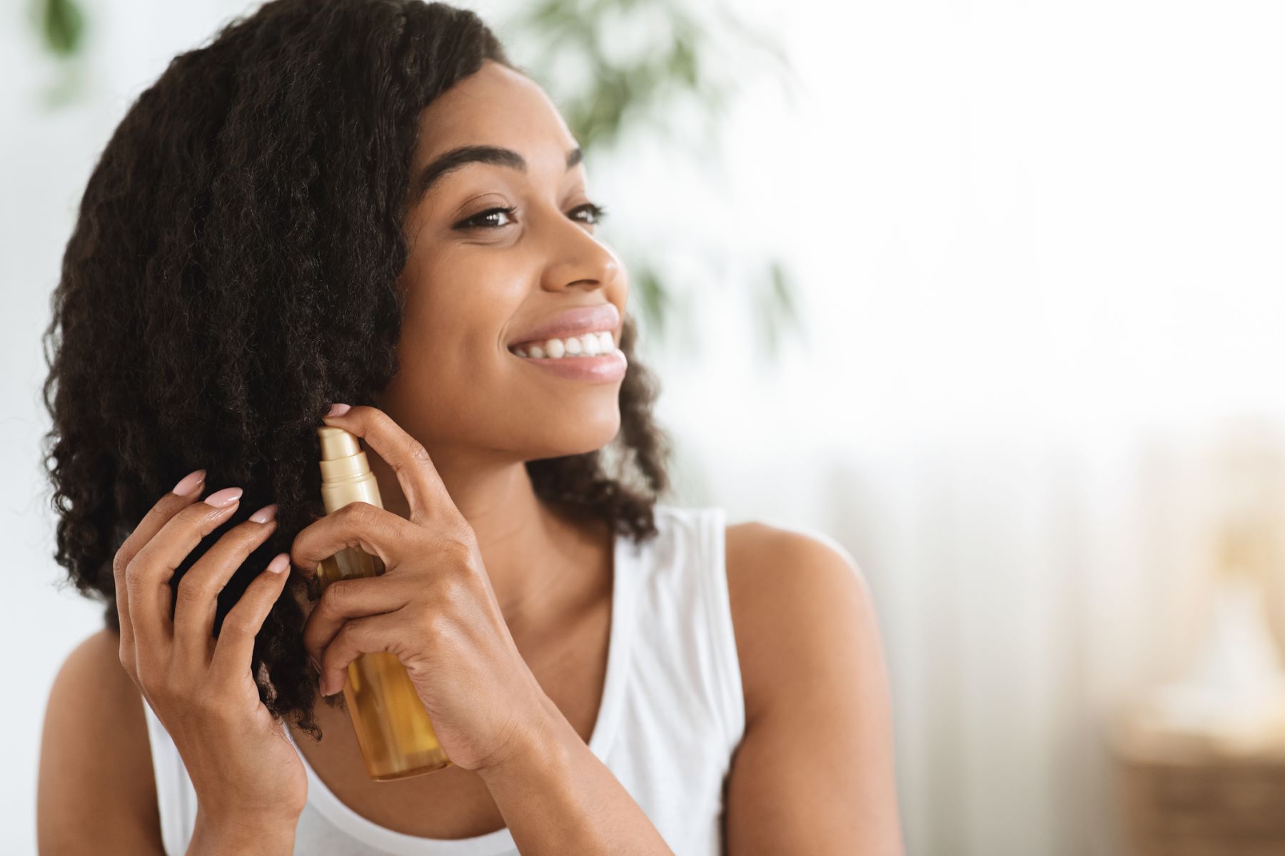 Woman engaging in good hair styling practices