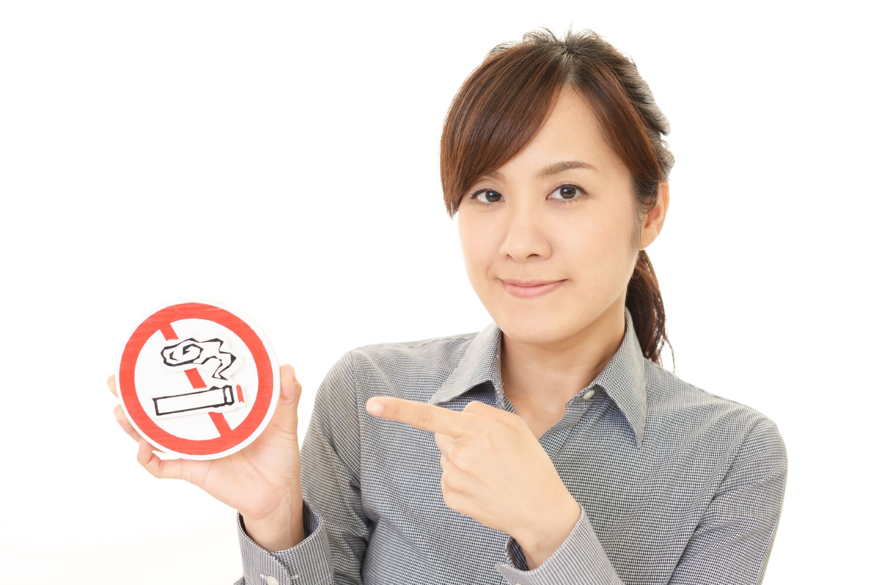 Woman pointing to smoking cessation sign