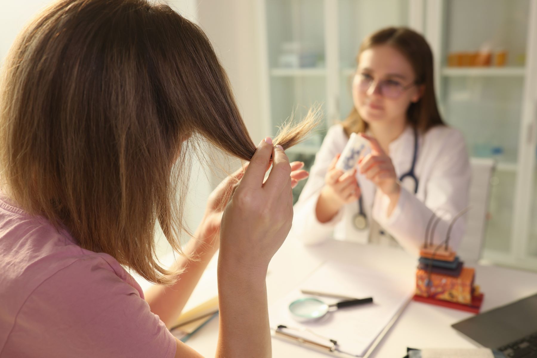 Woman seeing a trichologist for damaged 2a hair