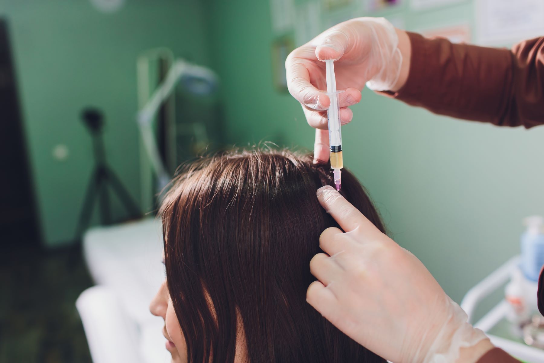 Woman undergoing PRP injection treatment