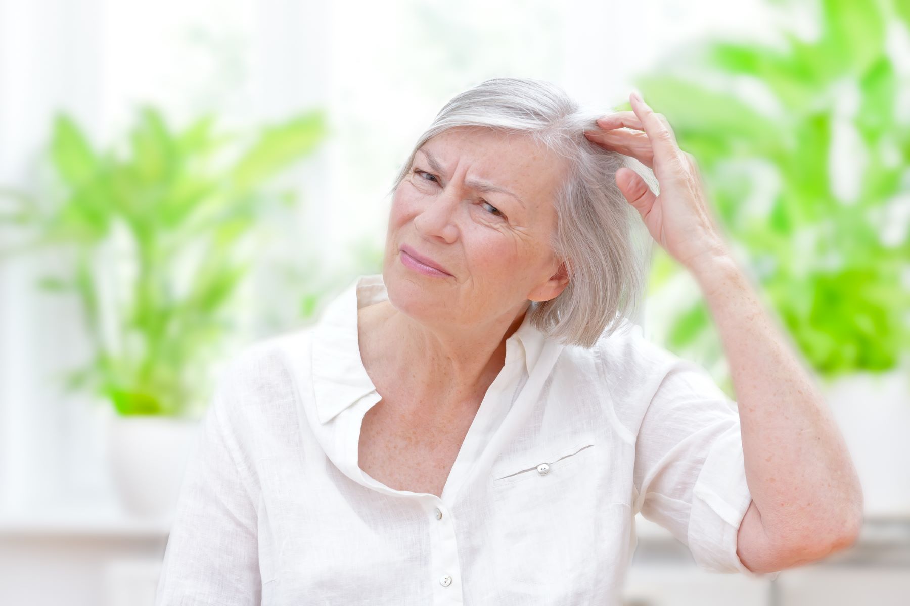 Woman unhappy with her thin hair