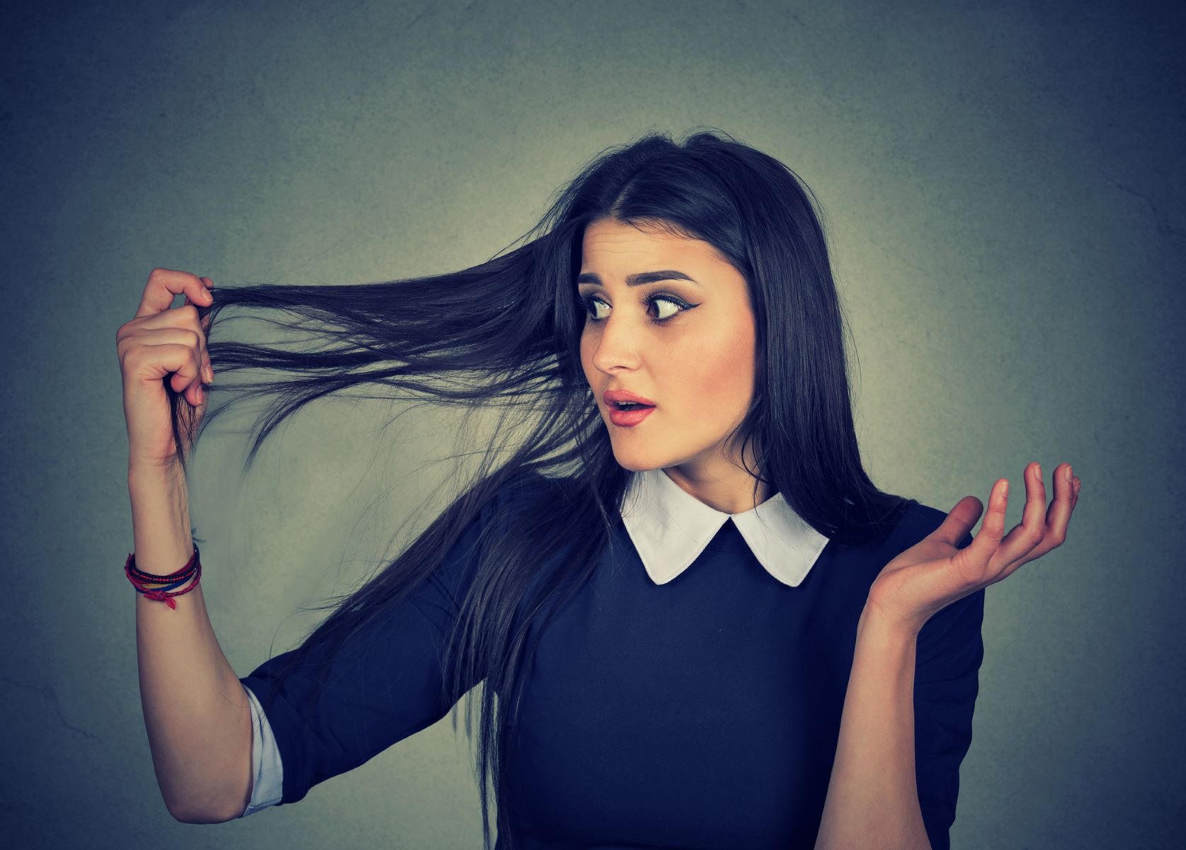 Woman wondering how to thicken her hair in a month