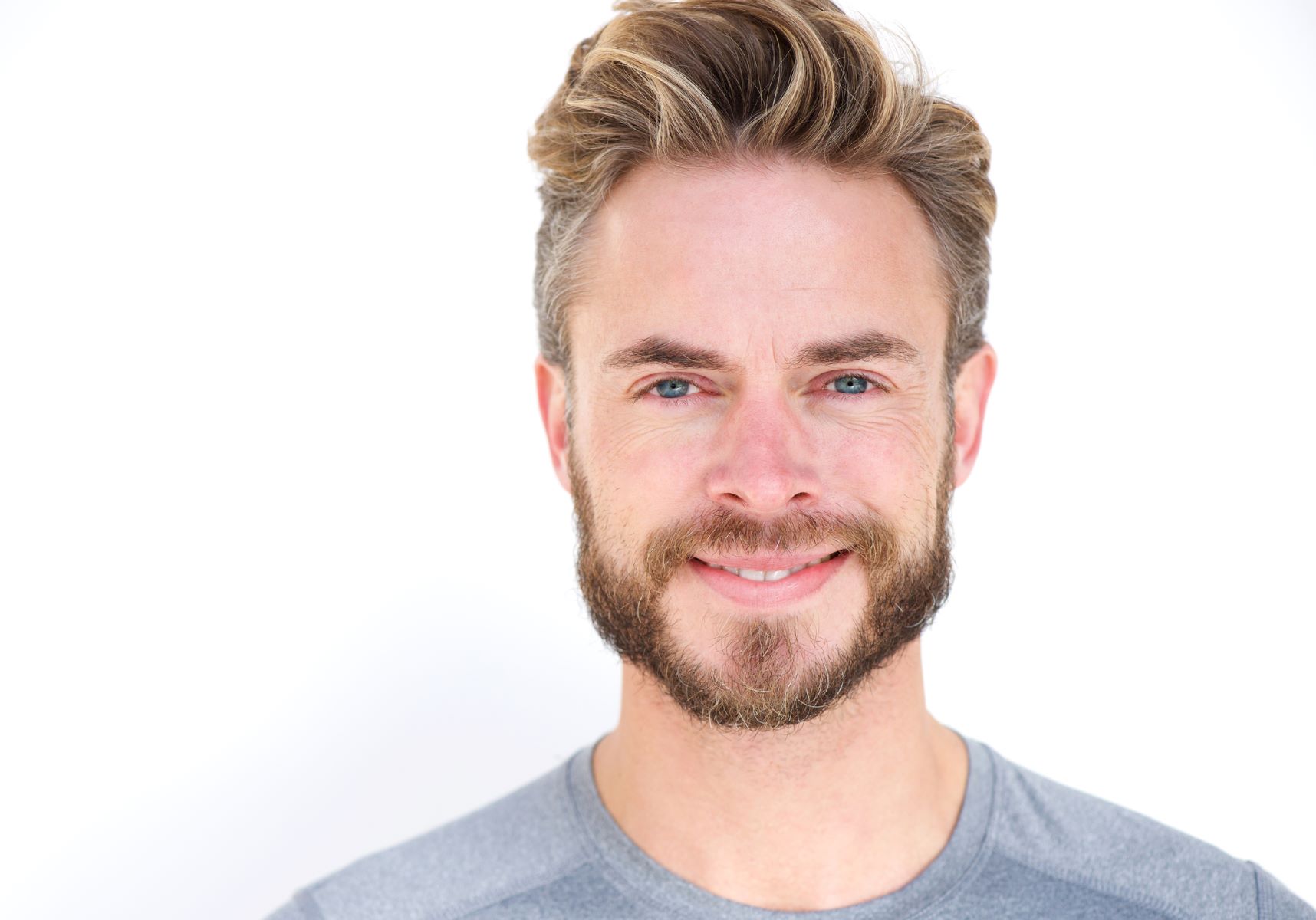 Young man with a well-groomed diamond-style beard.