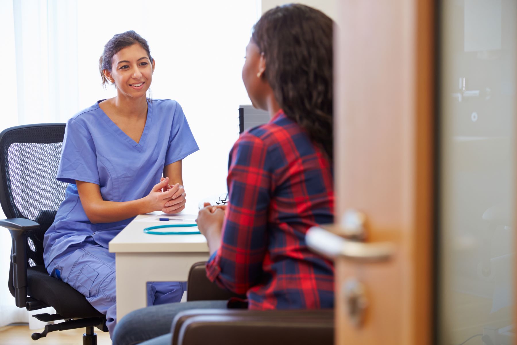 Doctor discussing forehead reduction surgery with the patient