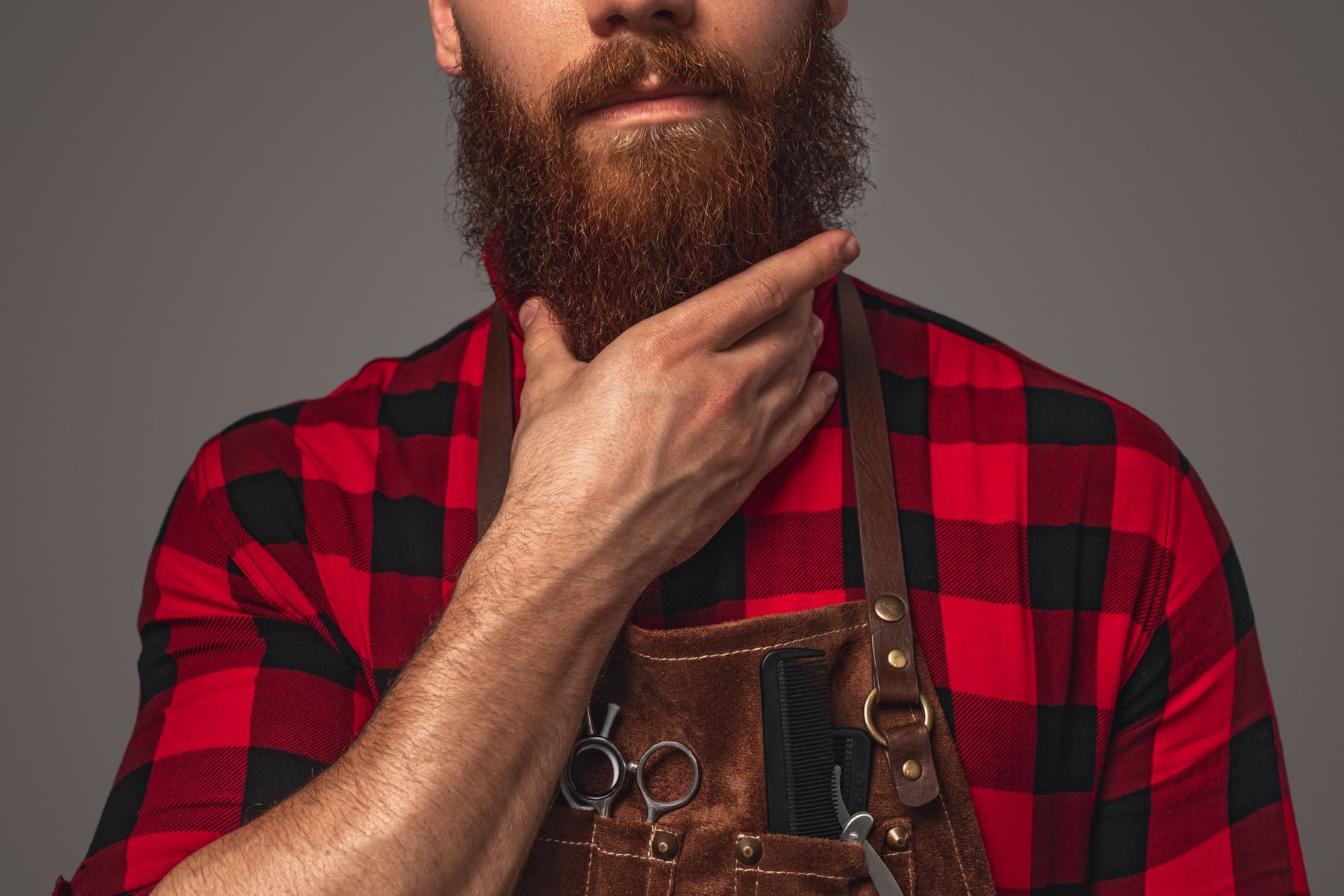 Man stroking his full beard