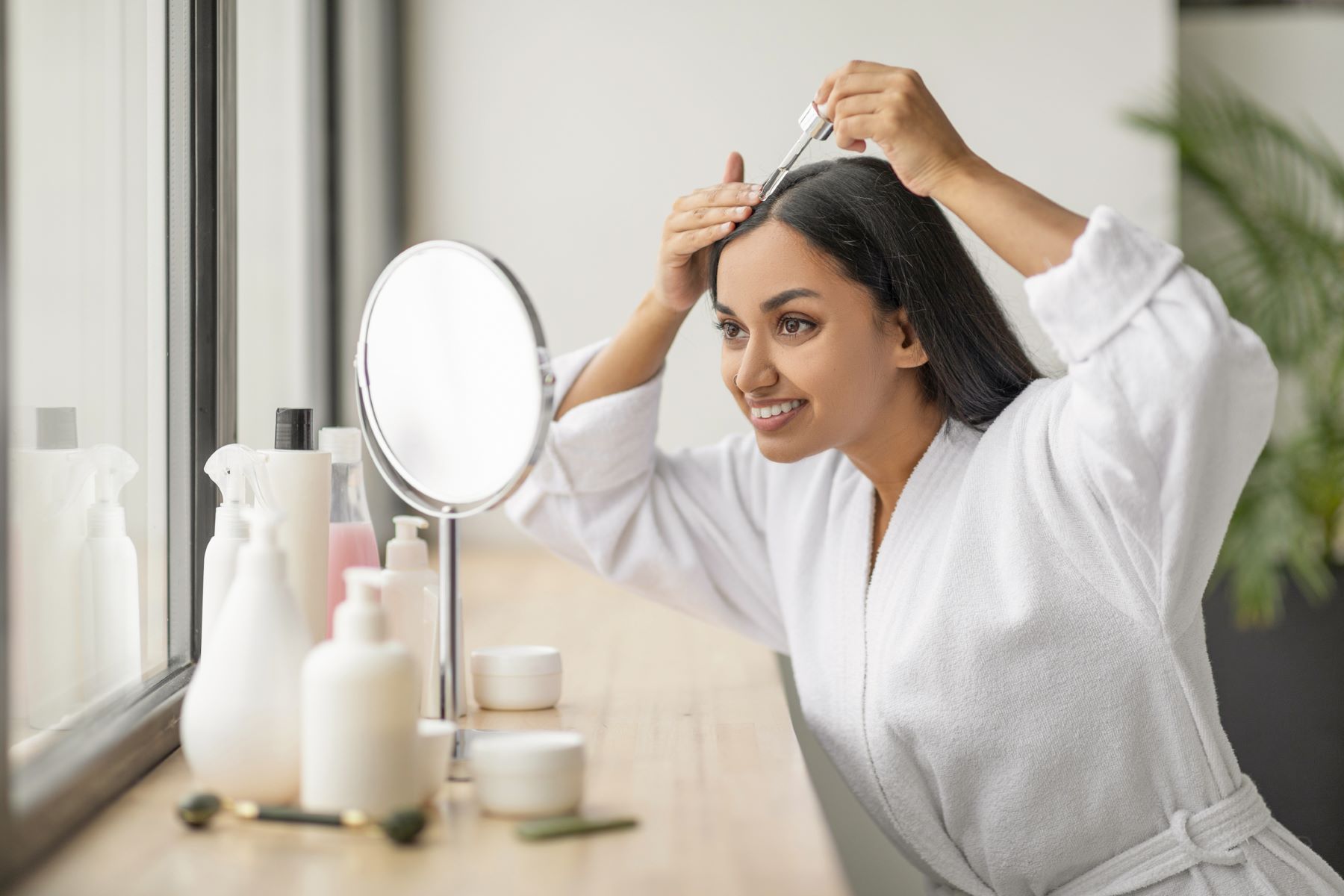 Woman using hair growth medication