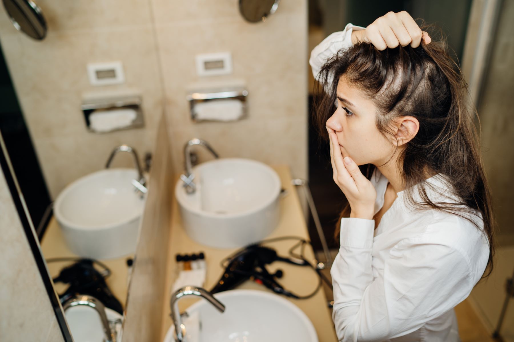 Woman wondering about hair restoration