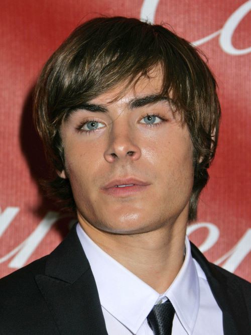 Zac Efron wearing a mop top hairstyle