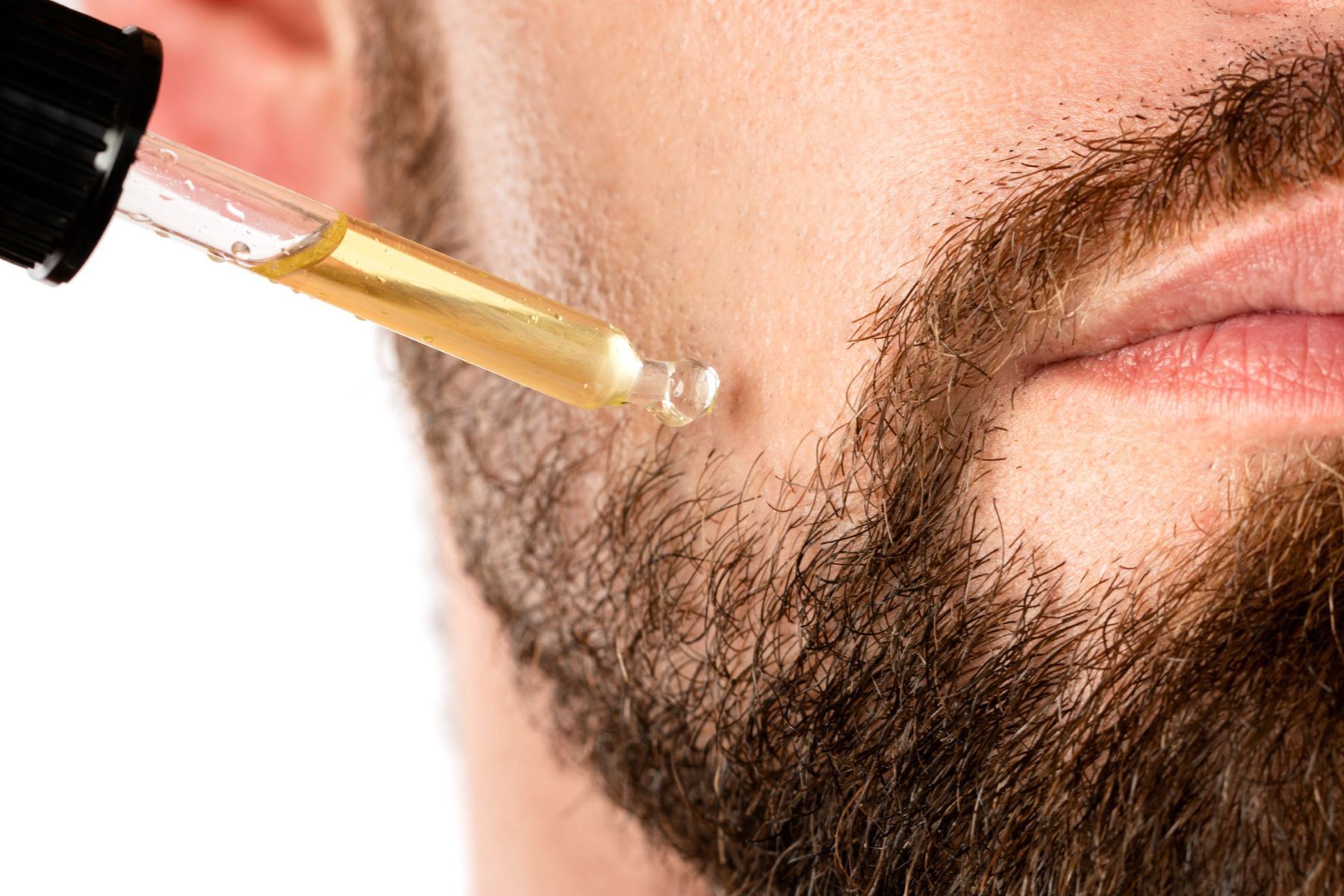 man using home remedies for beard bald spots