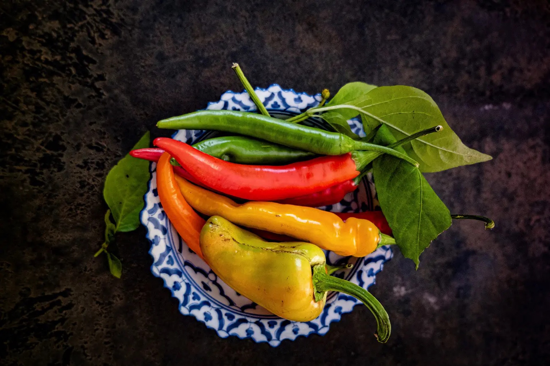 various chili peppers in a bowl