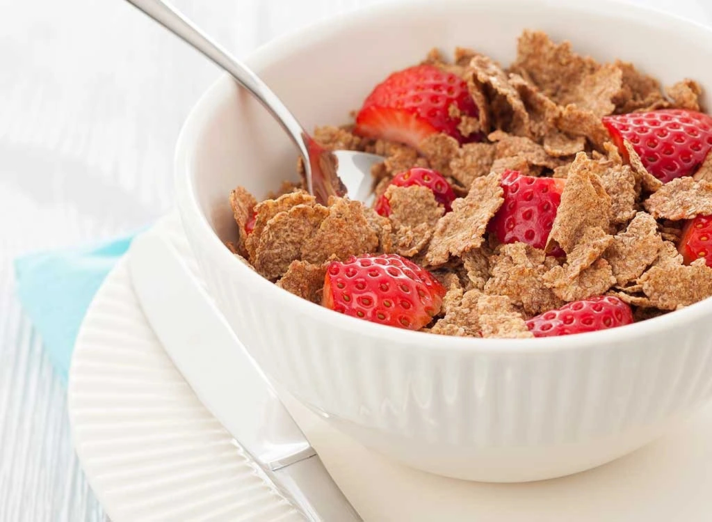 a bowl of cereal with strawberries