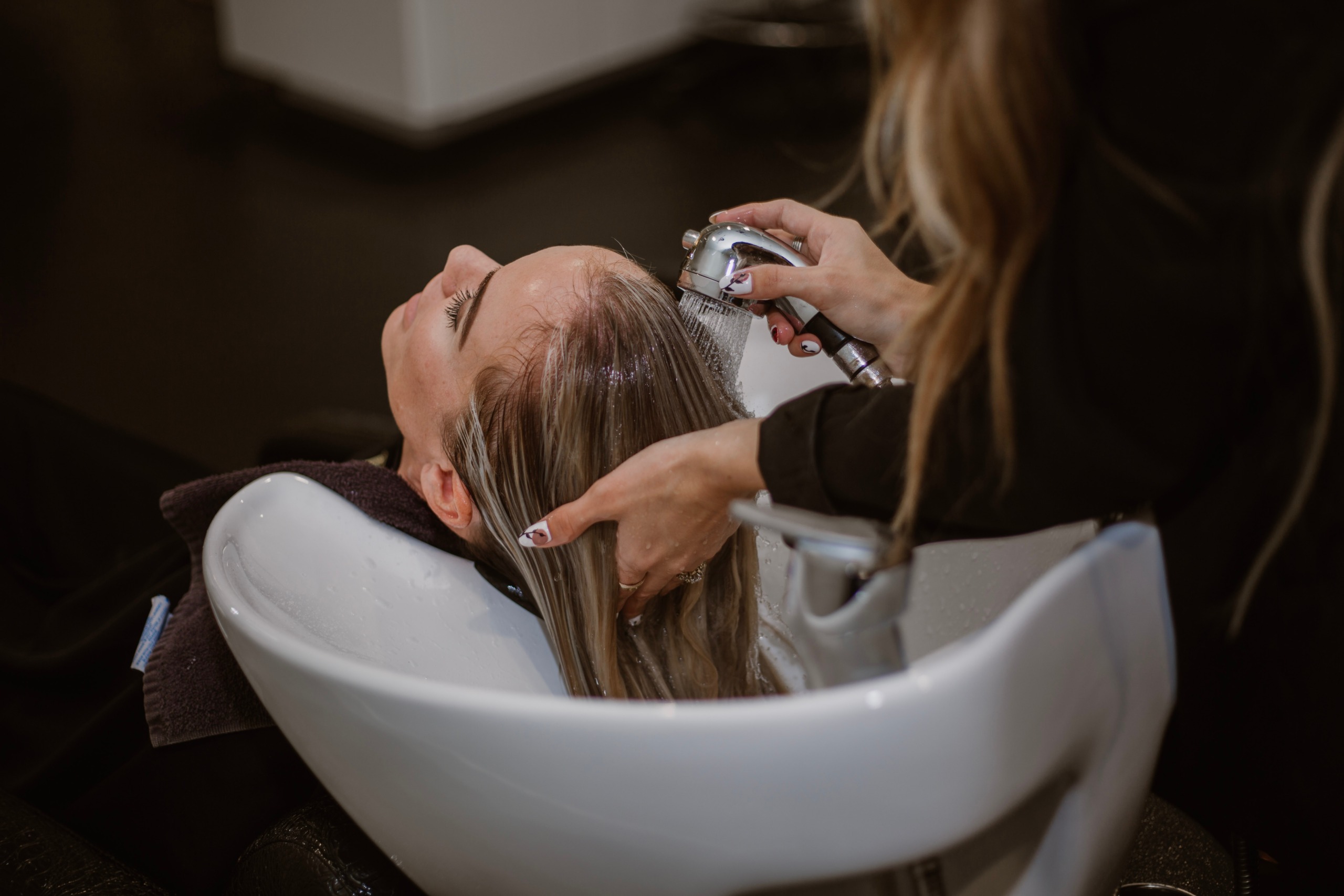 Woman getting her hair washed