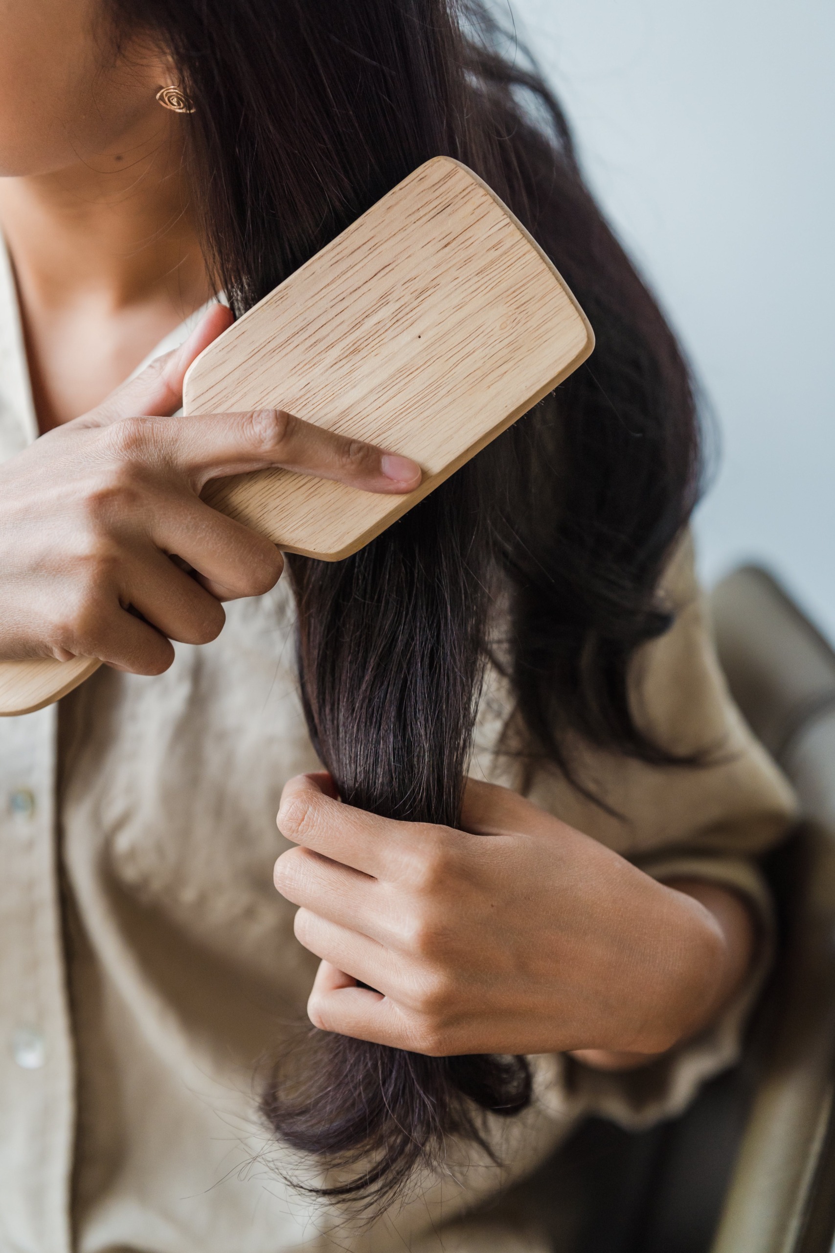 brushing dry hair with a boar bristle brush